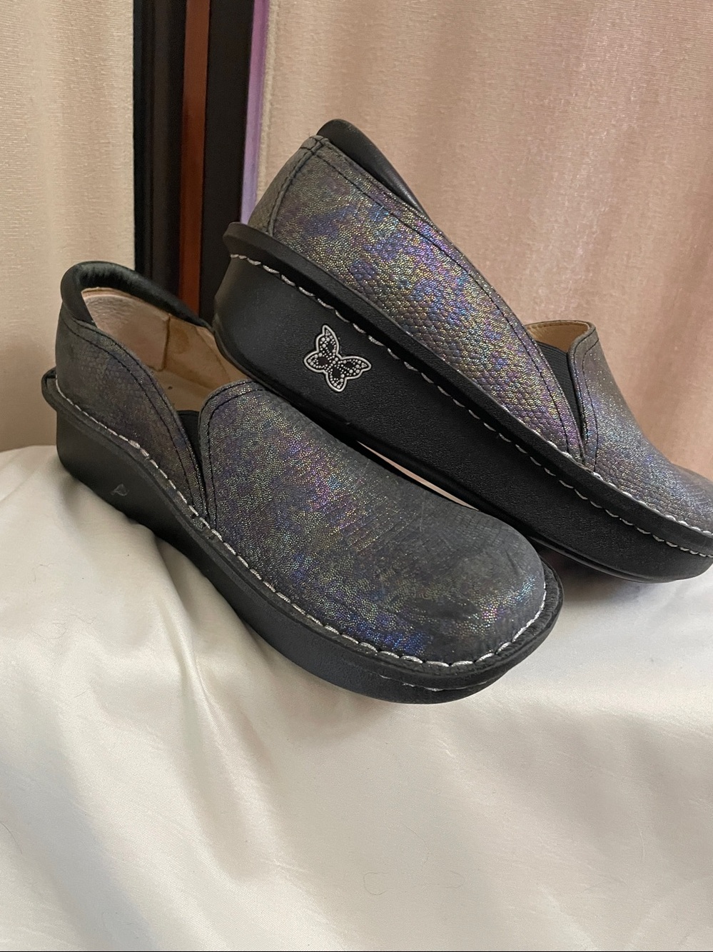 Alegria Iridescent Slip-On Clog with Butterfly Logo.